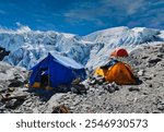 Mera Peak expedition mess tent and climbers tent pitched in Mera Peak High camp,a secure rocky shelter at 5900 m where climbers rest before heading for the summit of Mera Peak,6461 m, Himalayas,Nepal