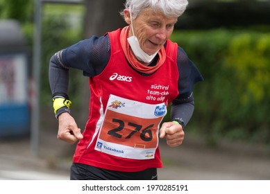 MERANO, ITALY - May 02, 2021: Amazing Older Woman Participant Of The Half Marathon - 21 0975 Km And Fitness Run - 12 5 Km In Merano, South Tirol, Italy On May 2nd, 2021 