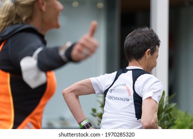 MERANO, ITALY - May 02, 2021: Amazing Older Woman Participant Of The Half Marathon - 21 0975 Km And Fitness Run - 12 5 Km In Merano, South Tirol, Italy On May 2nd, 2021 