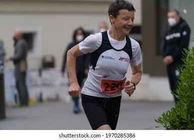 MERANO, ITALY - May 02, 2021: Amazing Older Woman Participant Of The Half Marathon - 21 0975 Km And Fitness Run - 12 5 Km In Merano, South Tirol, Italy On May 2nd, 2021 