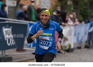 MERANO, ITALY - May 02, 2021: Amazing Older Woman Participant Of The Half Marathon - 21 0975 Km And Fitness Run - 12 5 Km In Merano, South Tirol, Italy On May 2nd, 2021 