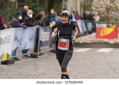 MERANO, ITALY - May 02, 2021: Amazing Older Woman Participant Of The Half Marathon - 21 0975 Km And Fitness Run - 12 5 Km In Merano, South Tirol, Italy On May 2nd, 2021 