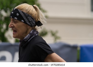 MERANO, ITALY - May 02, 2021: Amazing Older Woman Participant Of The Half Marathon - 21 0975 Km And Fitness Run - 12 5 Km In Merano, South Tirol, Italy On May 2nd, 2021 