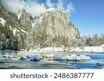 The Merced River looking into Yosemite Valley and El Capitan during the winter with snow. Yosemite National Park, California.