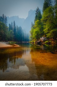 Merced River With Trees At Yosemite National Park. Vertical Image At Daytime