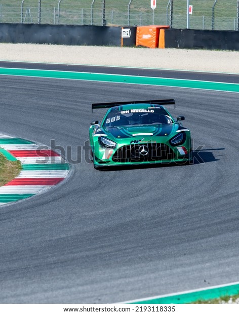 Mercedes AMG gt race car action on\
racetrack turn. Mugello, Italy, march 25 2022. 24 Hours\
series