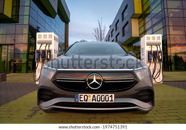 Mercedes EQA SUV at\
the fast charging\
station