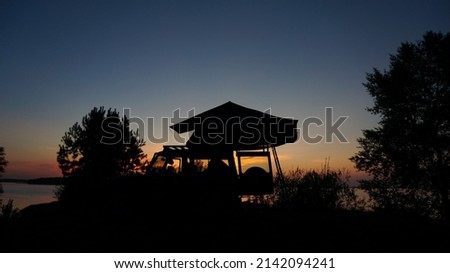 Mercedes G class with roof tent at sunset