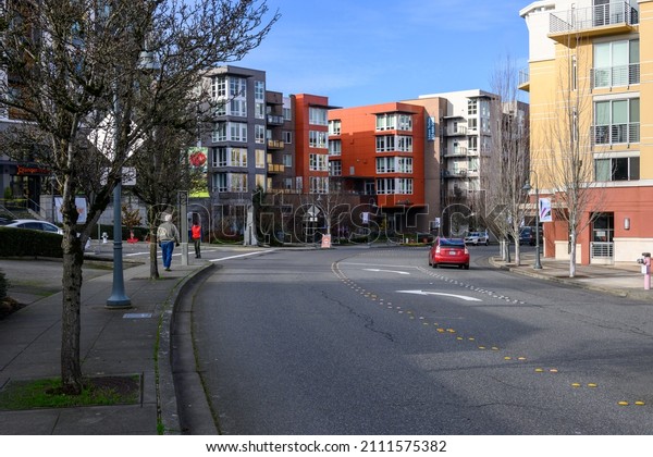 MERCER ISLAND, WA, USA – JANUARY 22, 2022:\
Downtown Mercer Island, curved street with modern mixed-use\
buildings on both\
sides\
