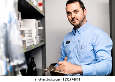 merchandiser checking products availibility for car repair - Shutterstock ID 1131994871
