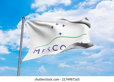 Mercosul Flag Waving In The Wind On Flagpole, On Sky Background