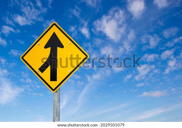 Merge road sign as symbol of cooperation. Merging\
Sign, Road, Diamond Shaped, Directional Sign. Business decisions\
concept with traffic sign