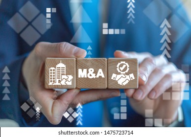 Merger And Acquisition Business Corporate Cooperation Company Concept. MA Partnership Concept On Wooden Dices In Businessman's Hands.