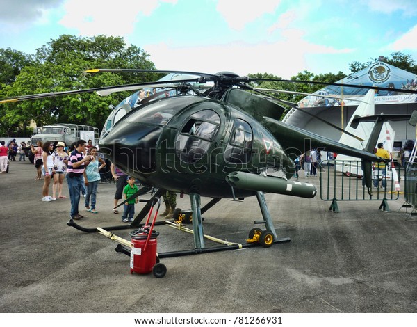 MERIDA, YUCATAN - OCTOBER 12\
2013: Vehicles of mexican army. military helicopter. Displayed\
during a show of mexican armed forces, in Merida, on October 12\
2013.