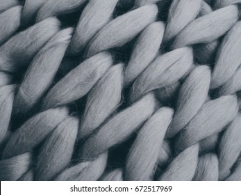 Merino wool handmade knitted large blanket, super chunky yarn, trendy concept. Close-up of knitted blanket, merino wool background - Powered by Shutterstock