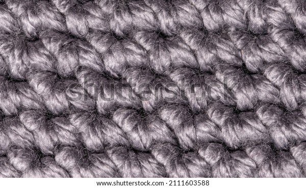 Merino wool handmade knitted large blanket,\
super chunky yarn, trendy concept. Close-up of knitted blanket,\
merino wool background