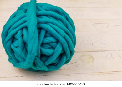 Merino Wool Yarn Ball On White Wooden Background