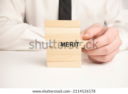merit business process symbol. Wood blocks stacking as step stair on white background, copy space. Businessman hand.