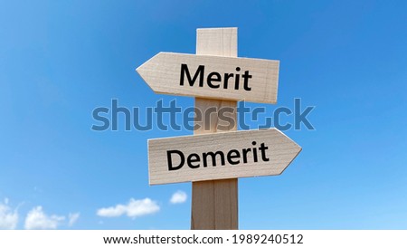 Merit and Demerit Lettered Road Signs and Blue Sky