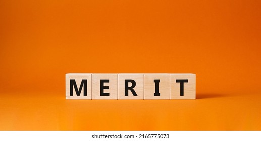 Merit Symbol. Concept Word Merit On Wooden Cubes. Beautiful Orange Background. Business And Merit Concept. Copy Space