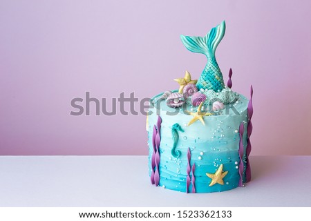 Mermaid birthday cake on a purple background