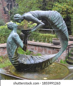 Mermaid And Merman Statue Kissing