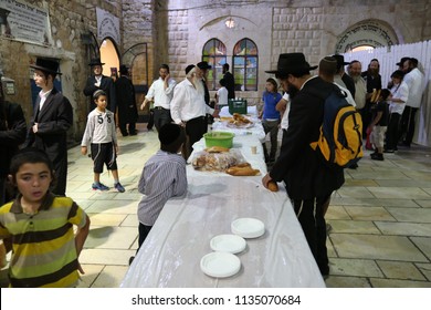 MERON, ISRAEL - AUG 1, 2017: Unidentified Jewish Men Break The Fast Of The Holiday Of Tisha Bav On A Meal In Meron, Israel