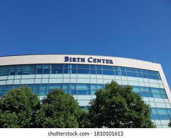 Merriam, Kansas / USA - August 20 2020: Sign For BIRTH CENTER At AdventHealth Medical Center Beneath Blue Sky