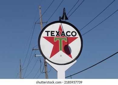 Merrillville - Circa July 2022: Texaco gas station legacy signage. Texaco is an oil brand owned and operated by Chevron Corporation.