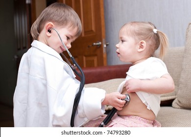 merry children playing as doctor and patient