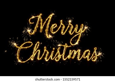 Merry Christmas of 2020. Text Merry Christmas written sparkling sparklers fireworks isolated on black background. Overlay template for christmas greeting card - Powered by Shutterstock