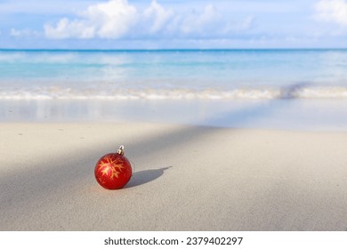 Merry Christmas background with red ball on Caribbean beach. - Powered by Shutterstock