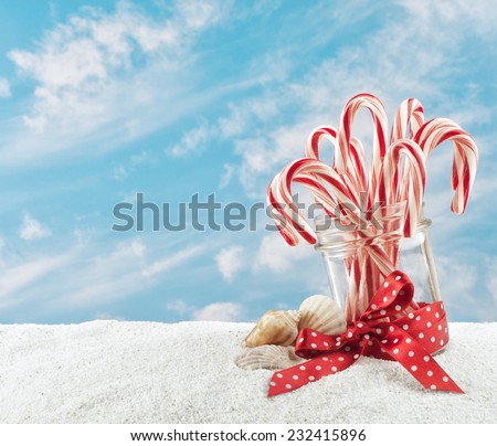 merry christmas at the beach with candy canes in a jar in the sand and sky - Merry Christmas Beach Images merry christmas at the beach with candy canes in a jar in the sand and sky - Merry Christmas Beach Images