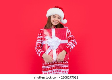 Merry Christmas. Cheerful Santa Claus Teen Girl With Christmas Present In Studio. Teen Girl