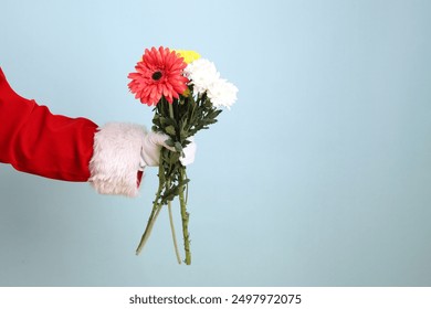 Merry Christmas, Cheerful senior man celebrate winter holidays is holding Bouquet, wearing Santa Claus costume isolated on yellow and blue background. Merry Xmas - Powered by Shutterstock