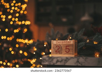 Merry christmas day 25 december eve event fairytale vibes. Sparkling bokeh garland shiny glister twinkle lights Noel tree decorations wooden cube calendar festive candles winter holidays spirit Xmas