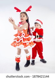 Merry Christmas Girl Wearing Santa Claus Suit Dancing Baby Shark On White Background