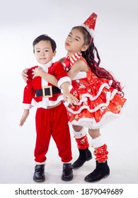 Merry Christmas Girl Wearing Santa Claus Suit Dancing Baby Shark On White Background