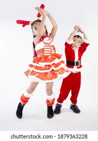 Merry Christmas Girl Wearing Santa Claus Suit Dancing Baby Shark On White Background