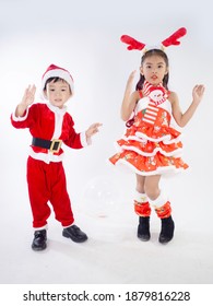 Merry Christmas Girl Wearing Santa Claus Suit Dancing Baby Shark On White Background