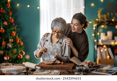 Merry Christmas and Happy Holidays. Family preparation holiday food. Mother and her adult daughter cooking cookies. - Powered by Shutterstock