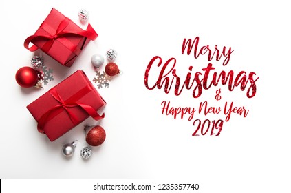 Merry Christmas and Happy Holidays greeting card, frame, banner. New Year. Christmas red gifts, presents on white background top view. Winter holiday xmas theme. Noel. Flat lay. - Shutterstock ID 1235357740