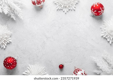 Merry Christmas and Happy Holidays greeting card, frame, banner. New Year. Noel. White Christmas white and red ornaments on white background top view. Winter holiday xmas theme. Flat lay.