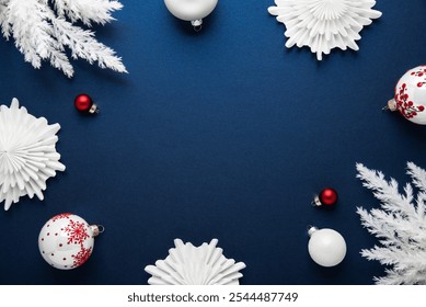 Merry Christmas and Happy Holidays greeting card, frame, banner. New Year. Noel. White and red Christmas ornaments on blue background top view. Winter holiday xmas theme. Festive Christmas design. - Powered by Shutterstock