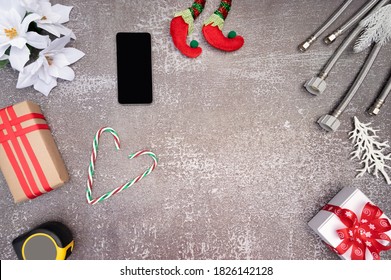 Merry Christmas  and Happy New Year holiday decoration with  construction tools.
Plumber Christmas. 
