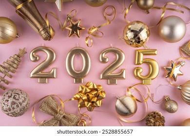 Merry Christmas and Happy New Year 2025 background with golden bauble, Christmas tree balls and decorations, gift bow, serpentine, 2025 golden candles numbers, flat lay top view copy space - Powered by Shutterstock