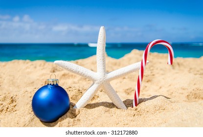 Merry Christmas And Happy New Year Background With Starfish And Ball On The Tropical Beach Near Ocean In Hawaii