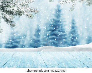 Merry christmas and happy new year greeting background with table .Winter landscape with snow and christmas trees - Powered by Shutterstock