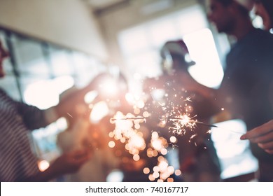 Merry Christmas and Happy New Year 2018! Multiracial young creative people are celebrating holiday in modern office. Group of young business people are drinking champagne in coworking.  - Powered by Shutterstock