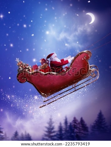Merry christmas and happy new year greeting card with copy-space. Winter  night landscape.Santa and his sleigh flying over snowy landscape 